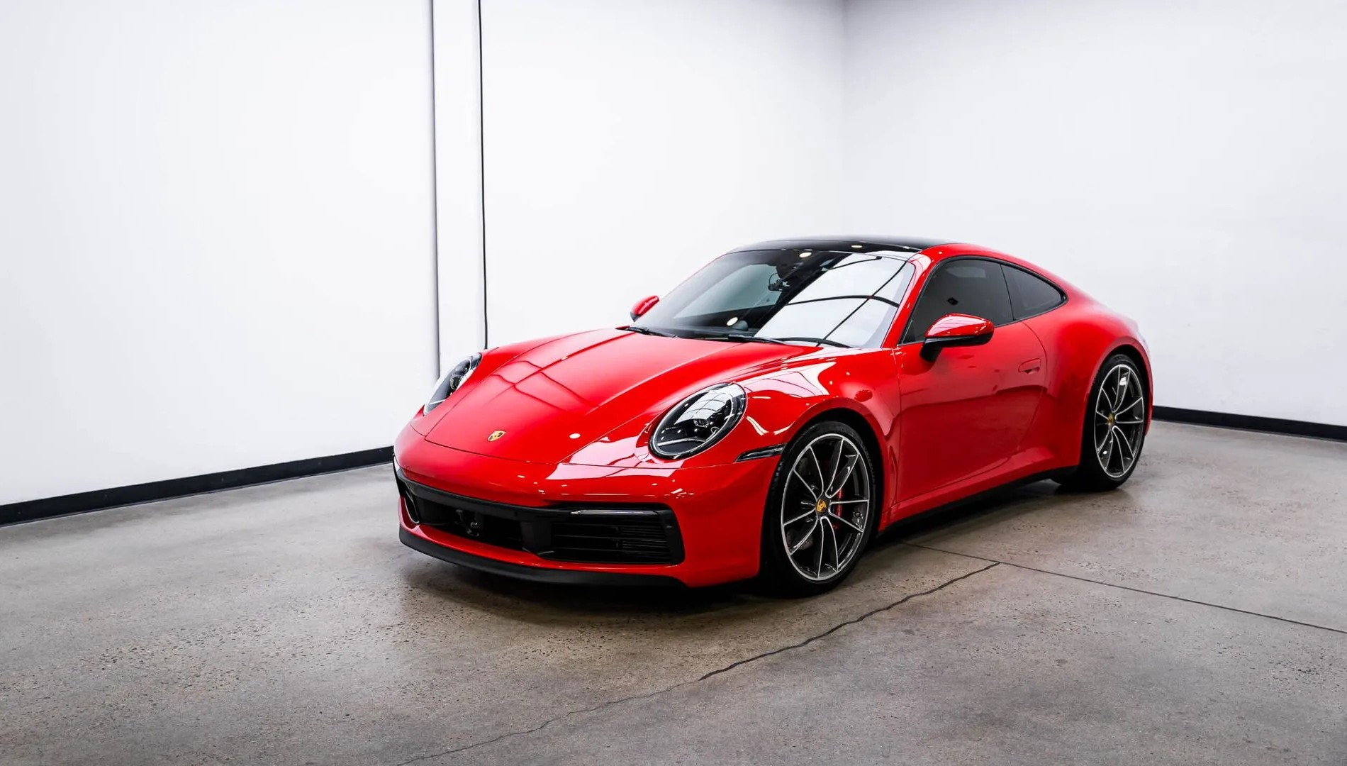 Red Porsche 911 with a glossy paint finish